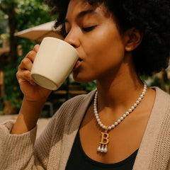 Anne Boleyn necklace being worn.
