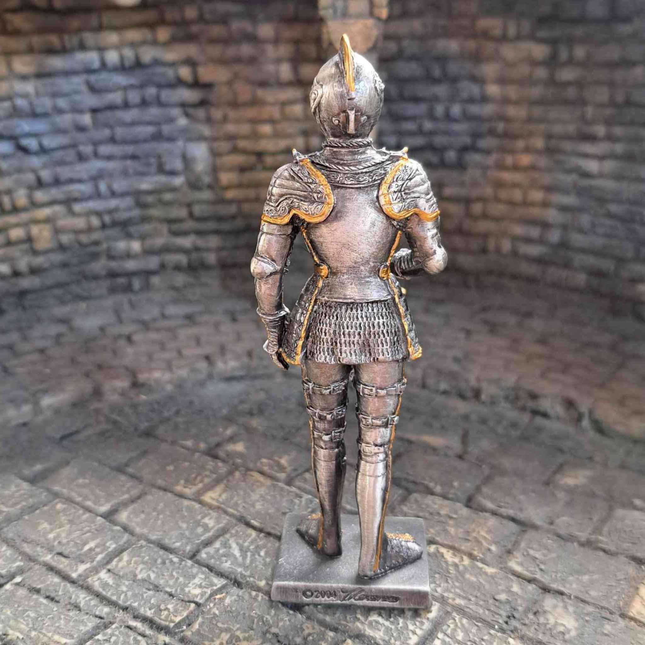 16th century knight with sword statue - back view