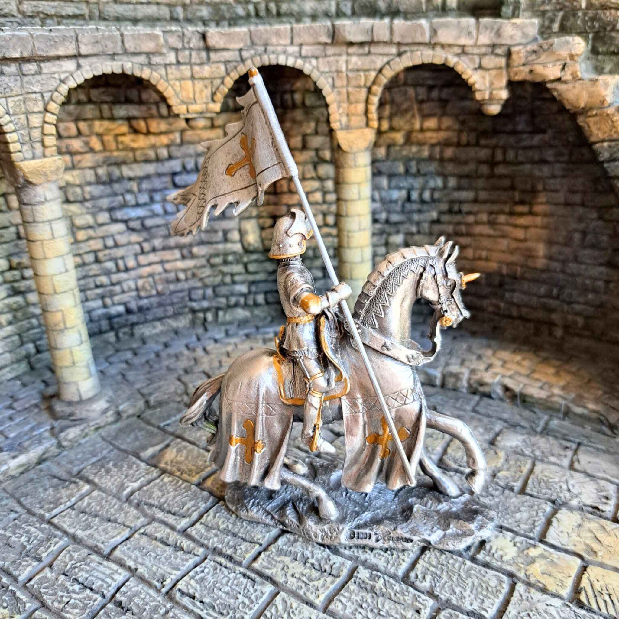 Back view of mounted pennant knight metal figurine