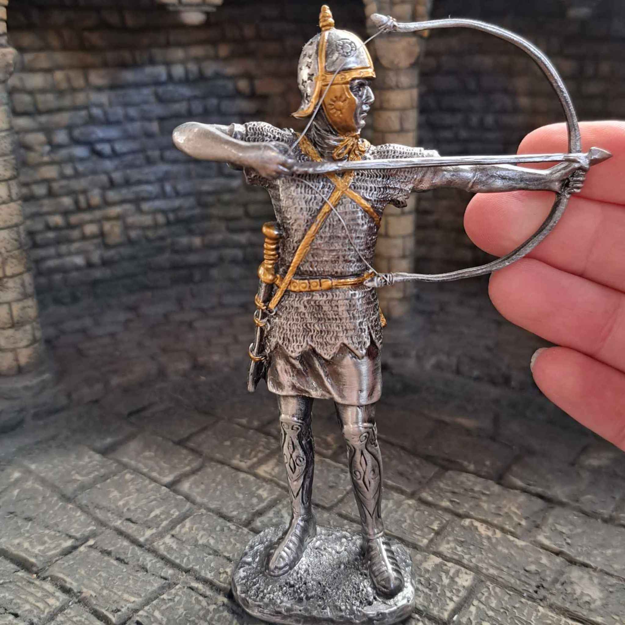 Medieval archer, knight with crossbow with hand pictured for scale