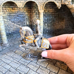 Metal Knight statue of a mounted knight with lance. Hand pictured for scale