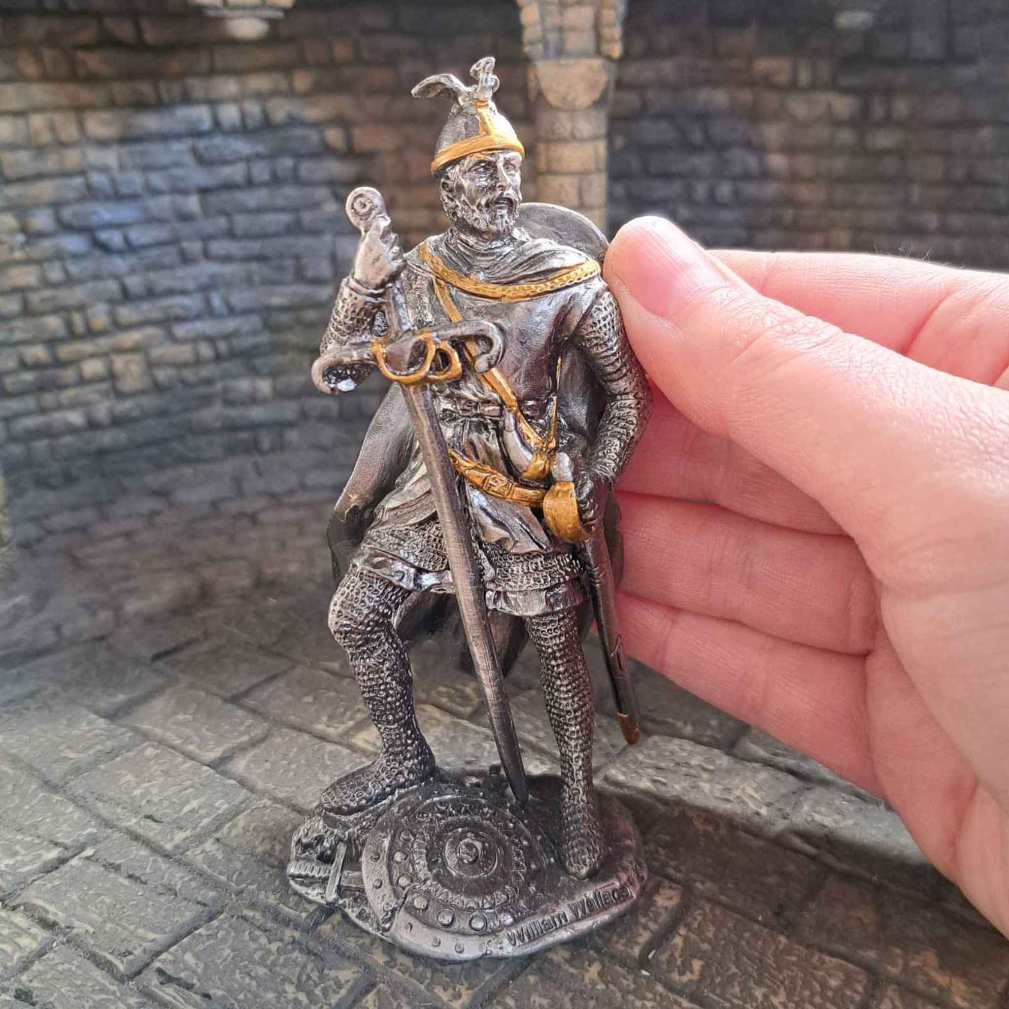 William Wallace metal knight pictured with hand for scale