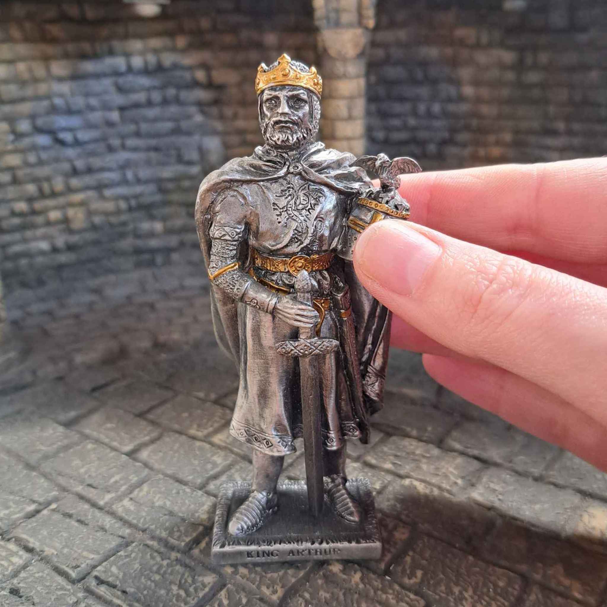 King Arthur Statue with hand pictured for scale