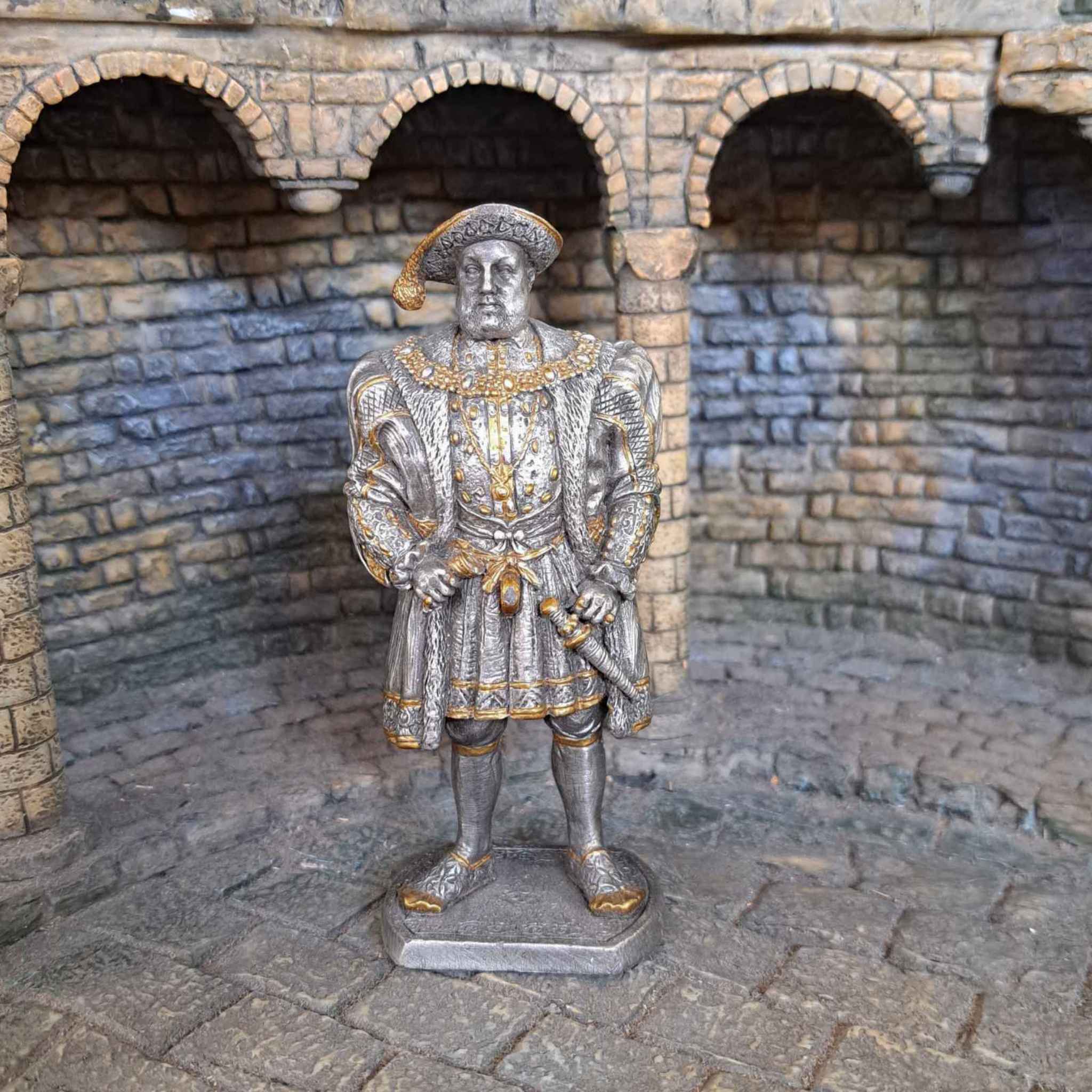 Henry VIII metal sculpture with medieval background