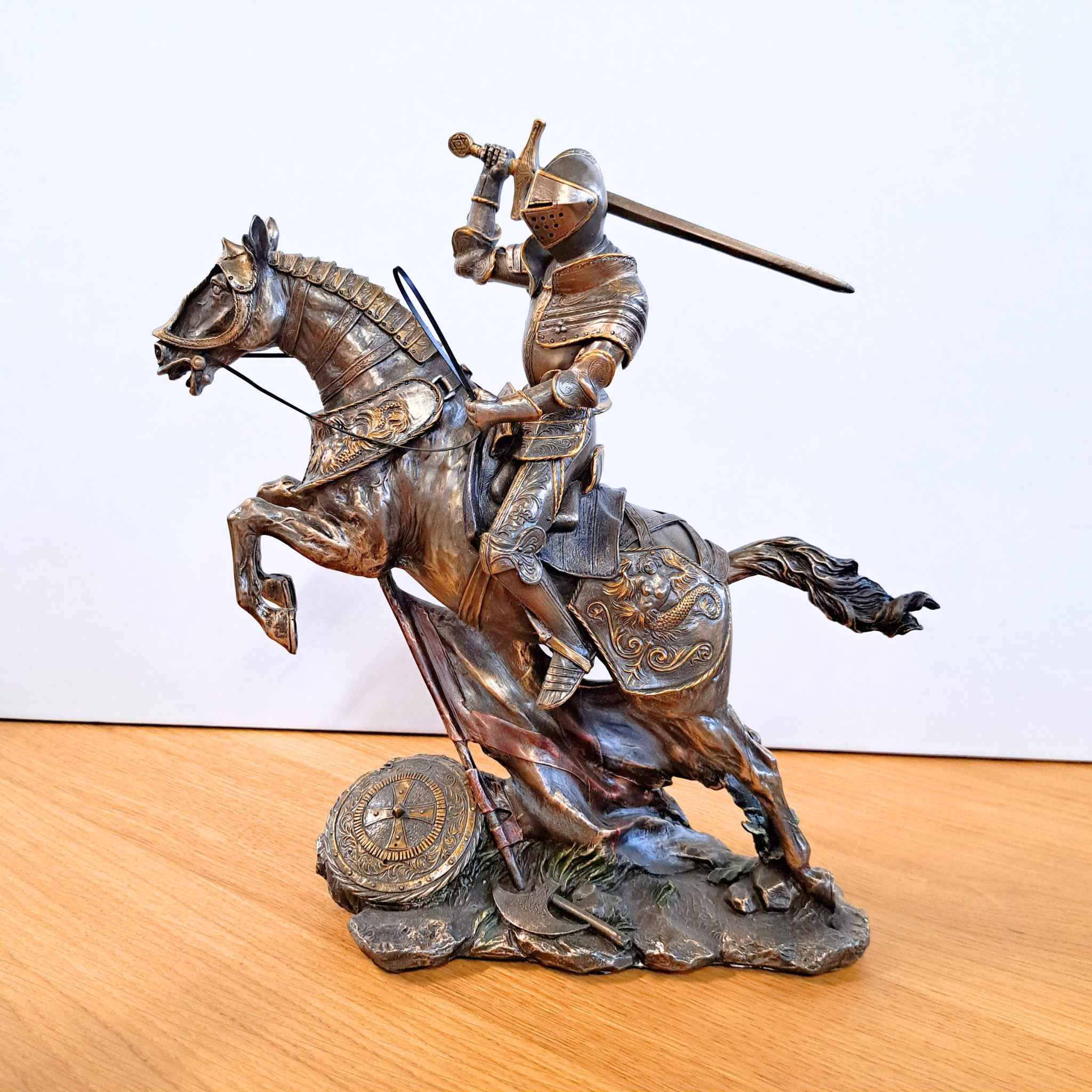 Large mounted knight with sword on desk