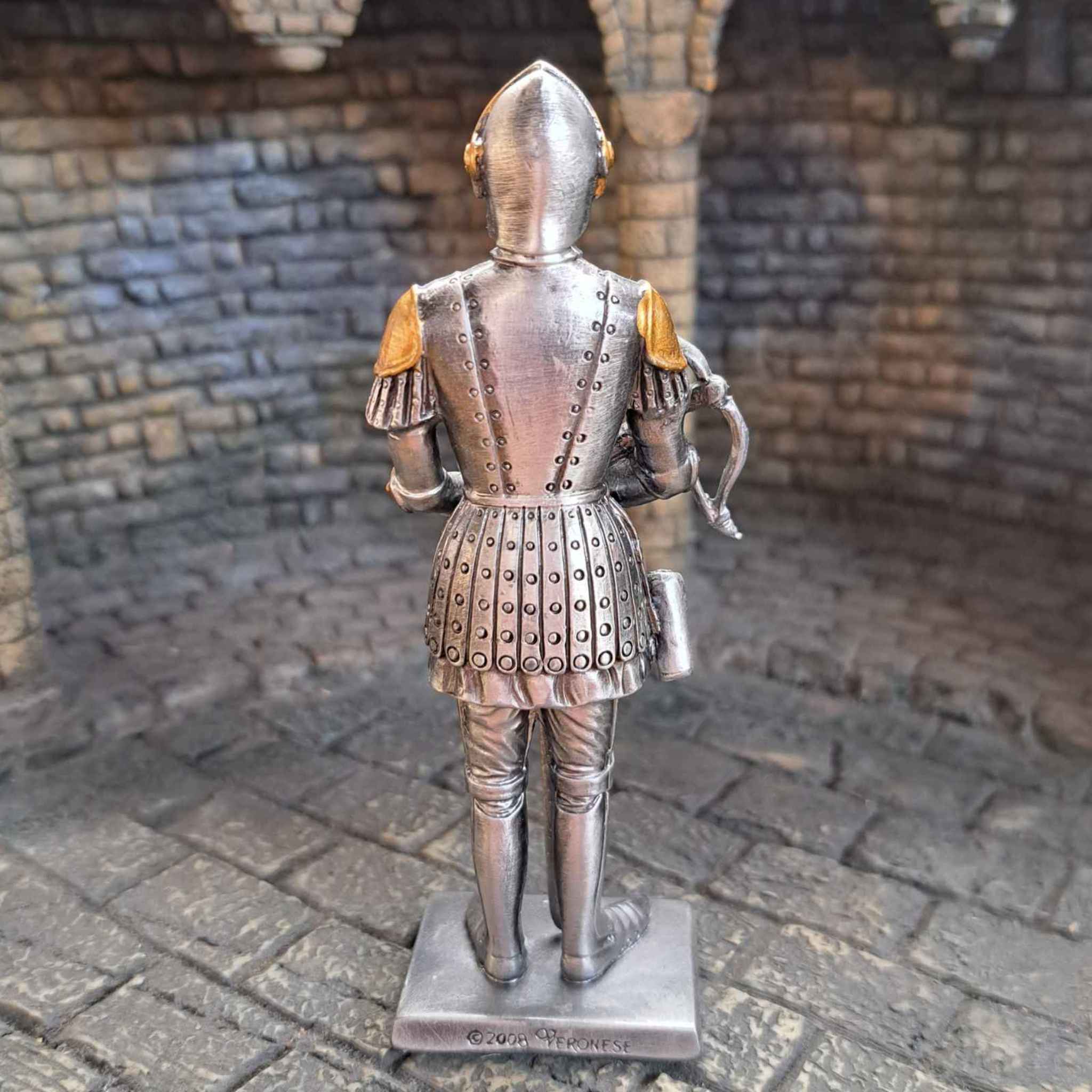 Metal knight with cross bow back view