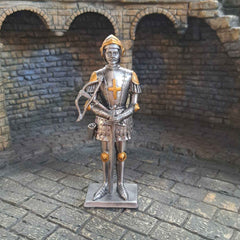 Metal knight with crossbow statue close up