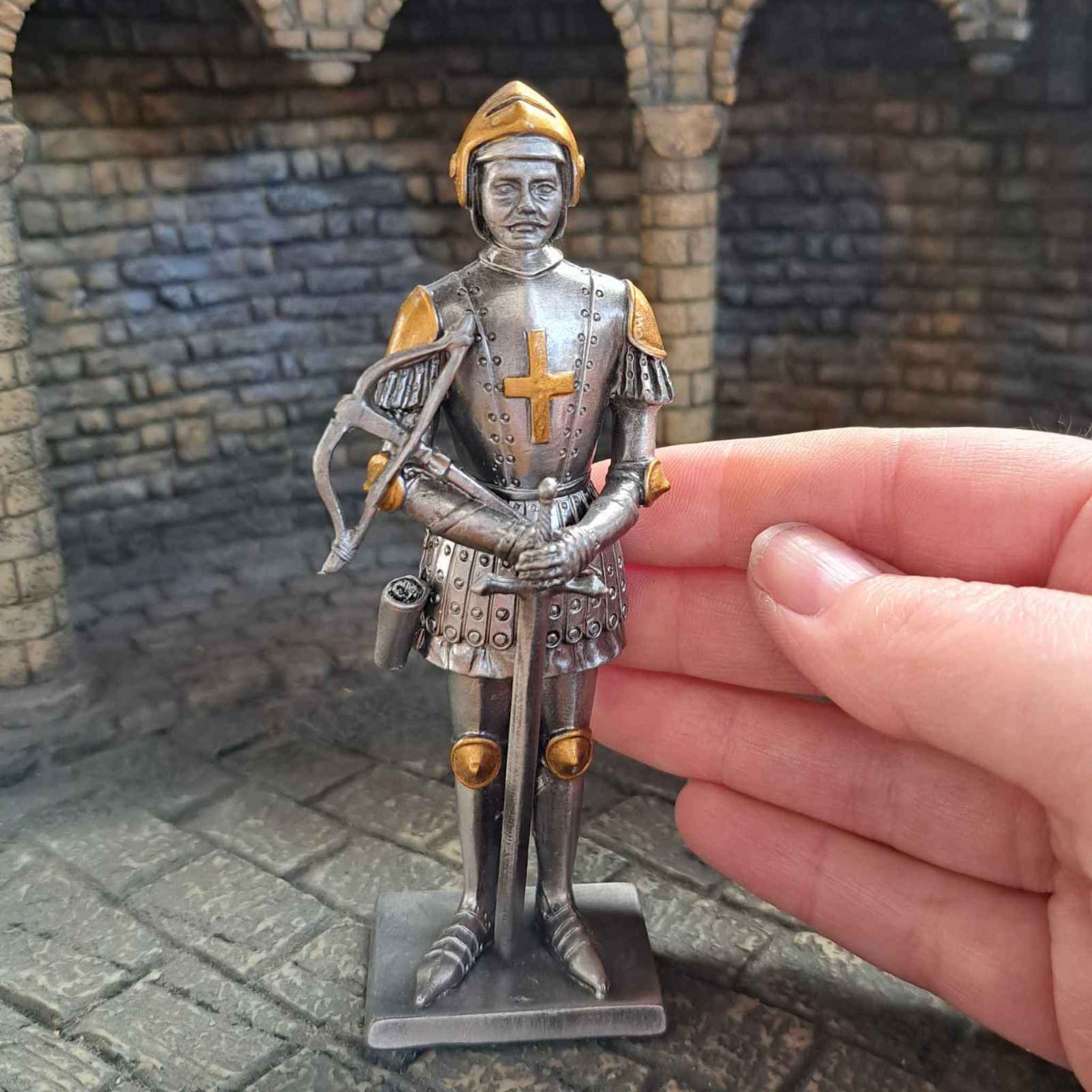 Knight with crossbow metal statue with hand pictured for scale